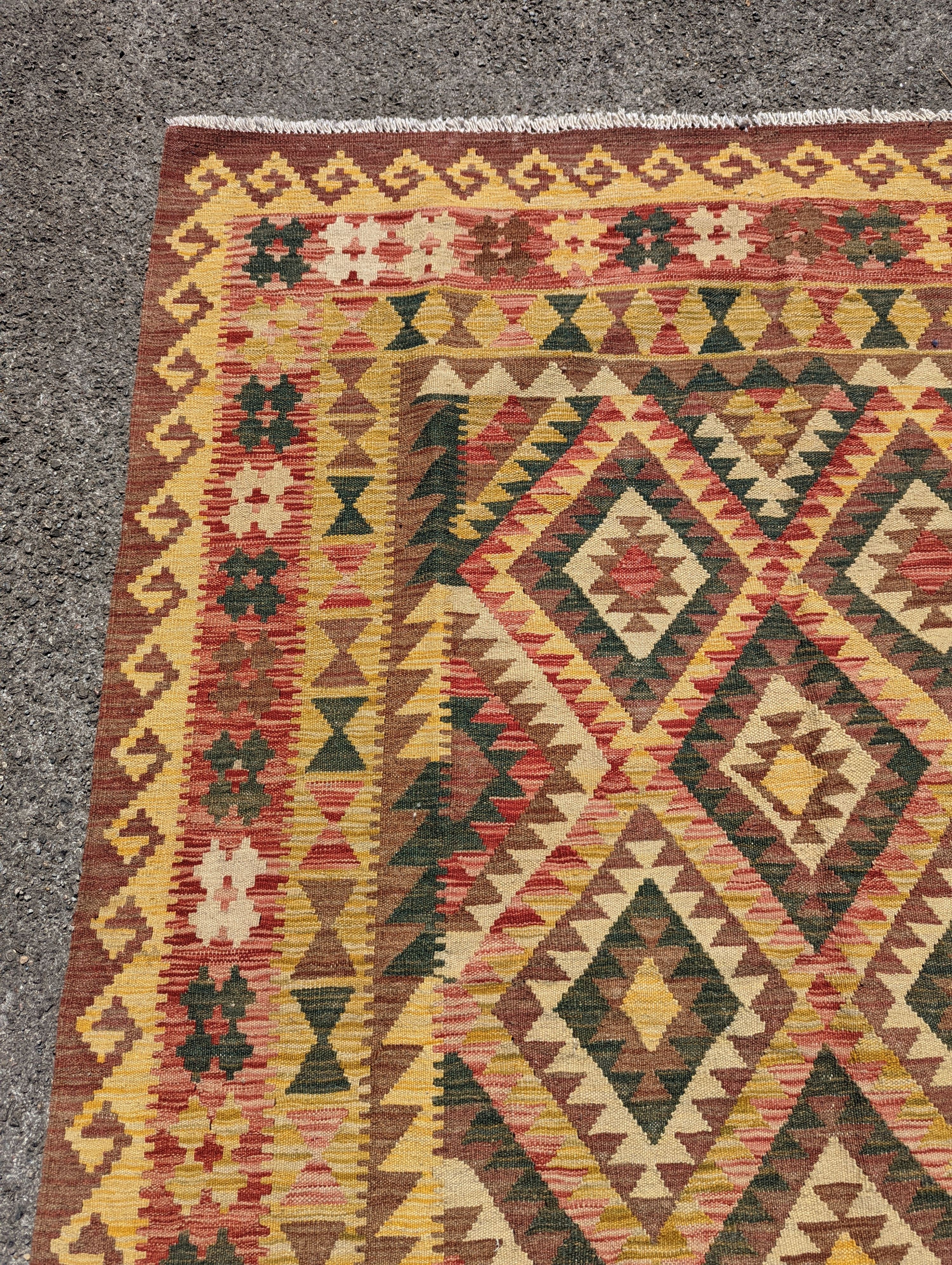 An Anatolian design polychrome geometric flatweave Kilim rug, 215 x 157cm